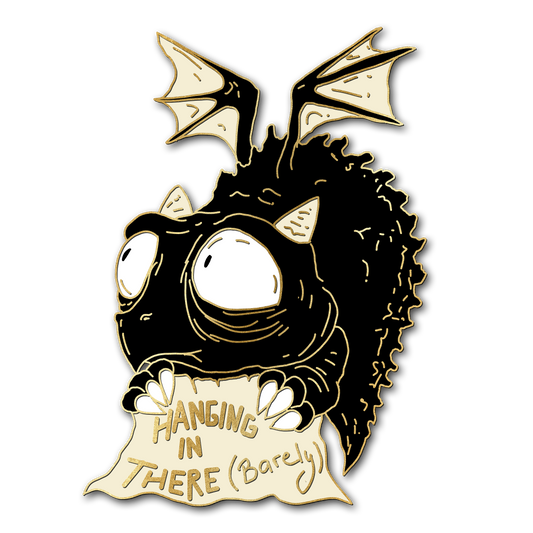 "Hanging in there (barely)" Derpy Dragon Pin